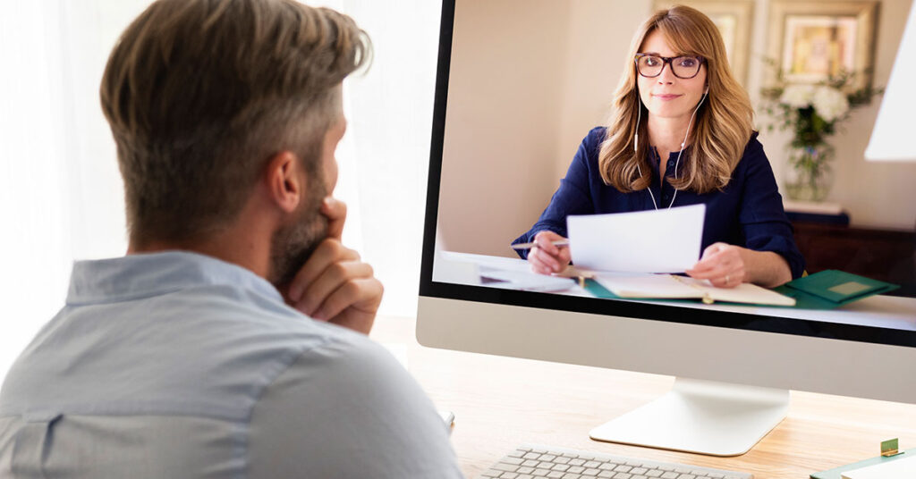 Businessman having video conference with businesswoman