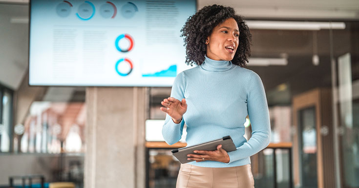 businesswoman presenting in staff meeting