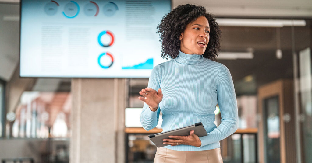 businesswoman presenting in staff meeting