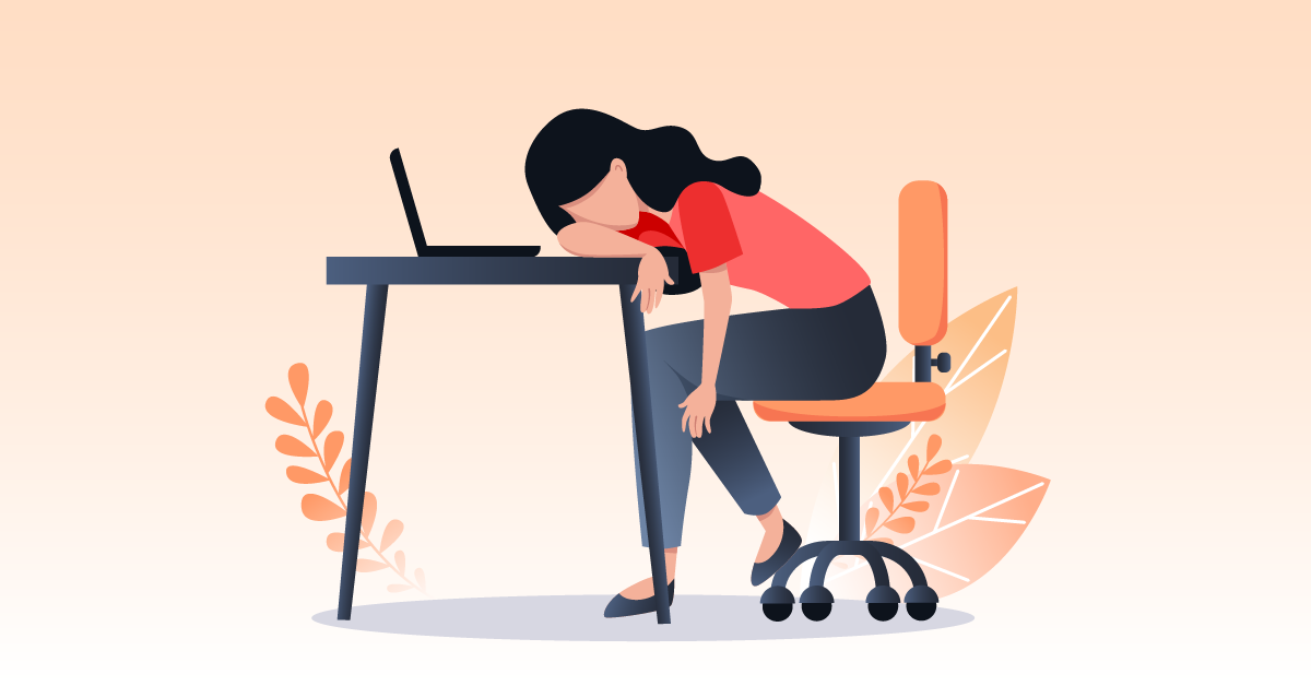 business woman with head down on her desk, burnout concept