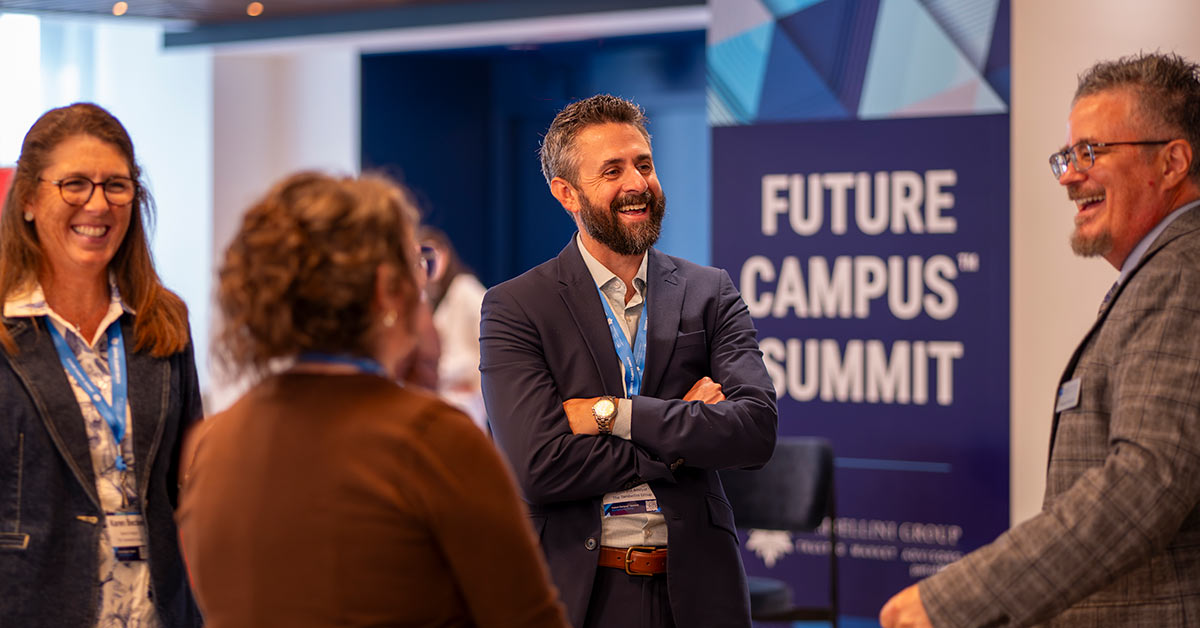 Group of Future Campus Summit attendees talking and laughing